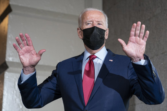 President Joe Biden speaks with reporters as he departs after a House Democratic Caucus meeting on Capitol Hill on Friday.
