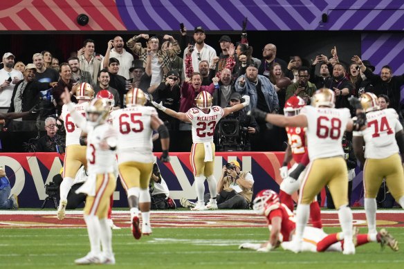 San Francisco 49ers running back Christian McCaffrey (23) celebrates a touchdown against the Kansas City Chiefs during the first half of the Super Bowl game in Las Vegas.
