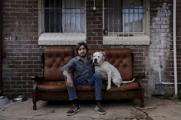 Matt Donn with his dog Tank at their Marrickville home. 