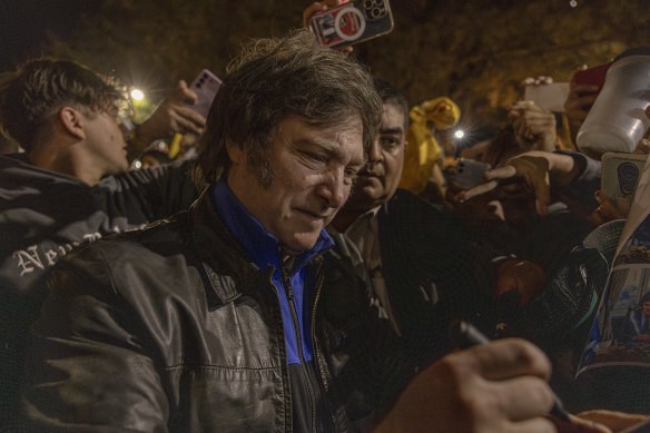 Far-right presidential candidate Javier Milei greets supporters during a rally in Argentina