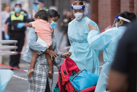 Returning travellers arrive at the Intercontinental Hotel to begin their quarantine period.