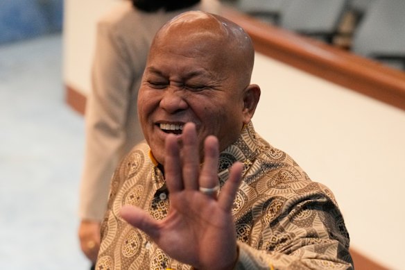 Philippine Senator Ronald Dela Rosa gestures to reporters at the Philippine Senate on Wednesday.