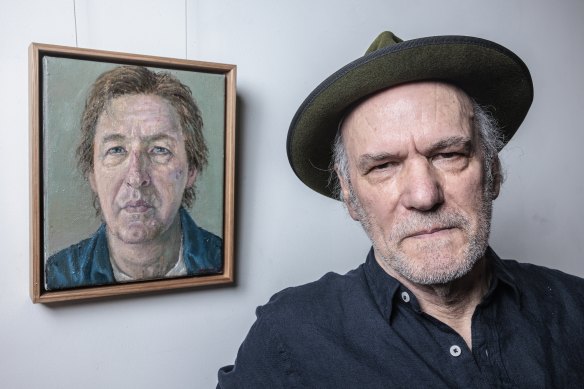 Moran prize winner Graeme Drendel poses next to his winning work ‘Portrait of Lewis Miller’ on Wednesday.