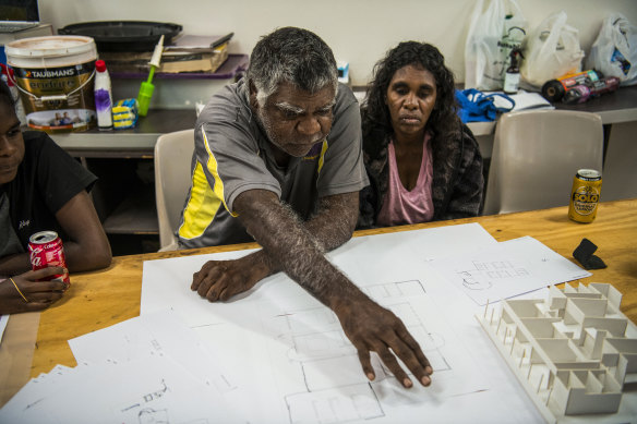 Norman Frank Jupurrurla and his wife Serena Morton Napanangka look over plans for the First Nations designed home. 