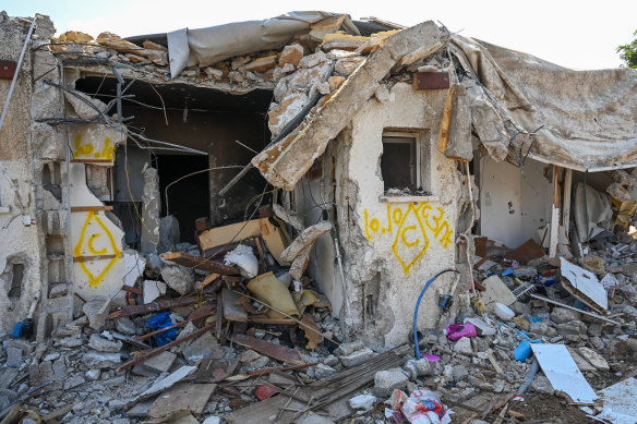 The view of a house left in ruins in Kfar Aza after the weekend attack by Hamas militants.
