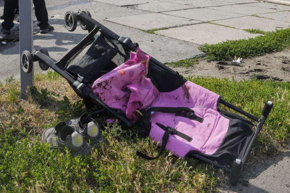 Blood stains are seen on a baby stroller after a deadly Russian missile attack in Vinnytsia, Ukraine, on Thursday.