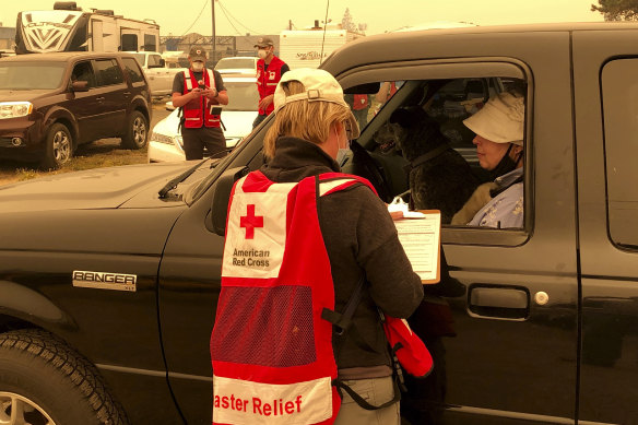 A Red Cross worker takes details from evacuees in Salem, Oregon.
