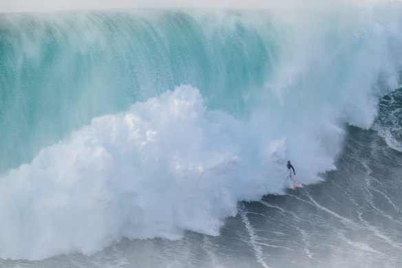 Will Santana of Brazil rides one of Nazare’s famouse big waves.