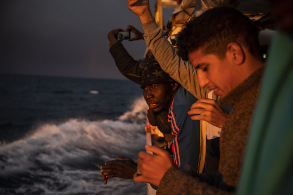 Nigeria and Morocco watch the sunset aboard the Open Arms rescue vessel in the Mediterranean Sea in January. Malta says it can no longer allow migrants to enter.