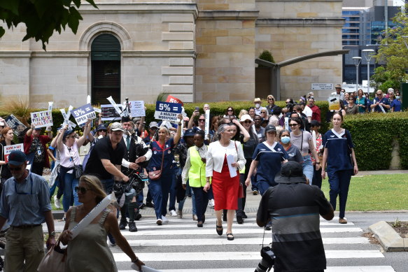 ANFWA secretary Janet Reah leading the rally to Dumas House.