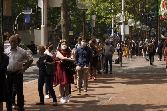 People queue for COVID-19 tests at Macquarie Street on Thursday morning.