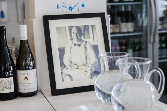 A framed family photo on the counter at Snack Kitchen.