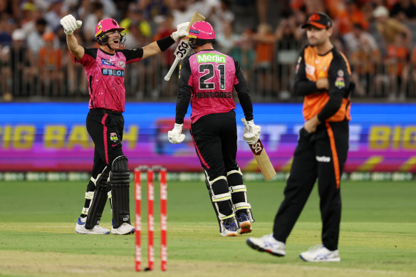 Sean Abbott and Moises Henriques of the Sixers celebrate the win off the last ball during the BBL match between Perth Scorchers and Sydney Sixers at Optus Stadium.