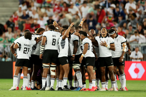 Fiji form a huddle before playing Wales