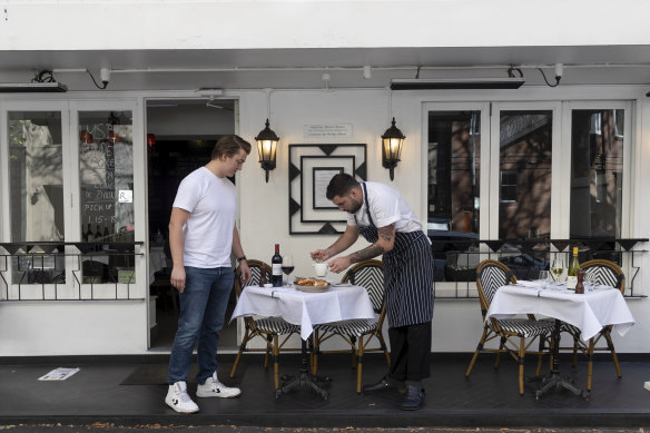 Chef Callum Brewin and waiter Gaetan Dossal are preparing the MacLeay Street Bistro in Potts Point ahead of eased lockdown restrictions.
