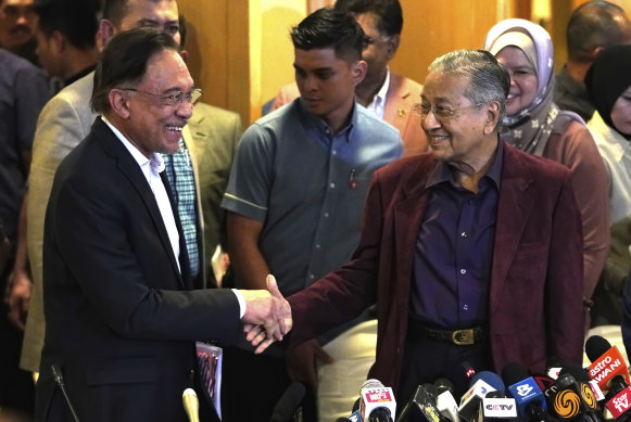 Anwar Ibrahim and Mahathir Mohamad in  Putrajaya, Malaysia on Saturday. Anwar said he wants Mahathir to be given space to run the country "without pressure".
