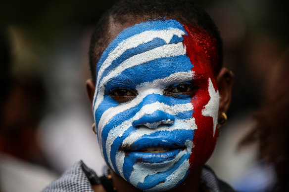 A West Papuan student’s face painted with the separatist Morning Star flag. 