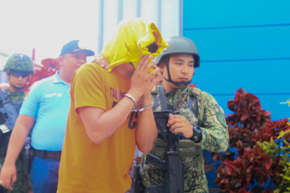 The suspect in the triple murder case being transferred to the Hall of Justice in Tagaytay City, Philippines. 