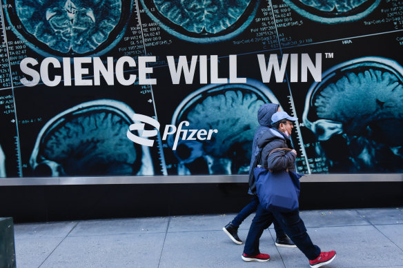 Pedestrians walk past Pfizer’s headquarters in New York City this month.
