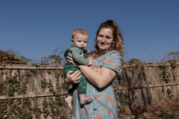 Abby Spyer and her baby Ronin in the backyard of the rented home she shares with her ex-partner.