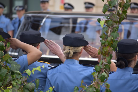 Police officers formed a guard of honour.