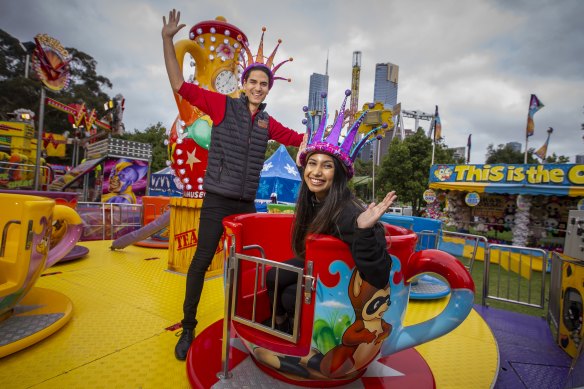 Moomba monarchs Pravini Fernando and Drew Law try out a teacup ride.