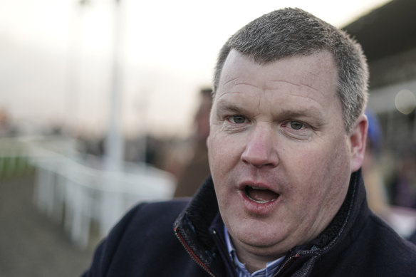 Trainer Gordon Elliott has been banned after a photo surfaced showing him sitting on top of a dead horse.