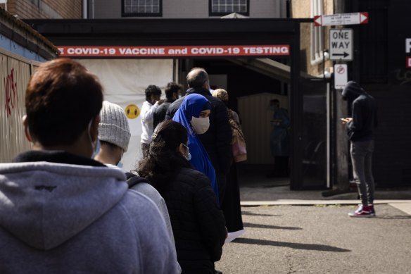 People wait for COVID-19 tests at a walk-in clinic in Lakemba on 28 August, 2021.