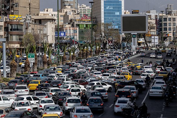Heavy traffic in Tehran, Iran, where large explosions shook the city and people reported seeing smoke rising from the district that includes the presidential palace on Saturday morning local time.