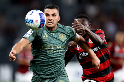 Melbourne City’s Andrew Nabbout  jostles for possession with Adama Traore of the Wanderers on Friday night. 