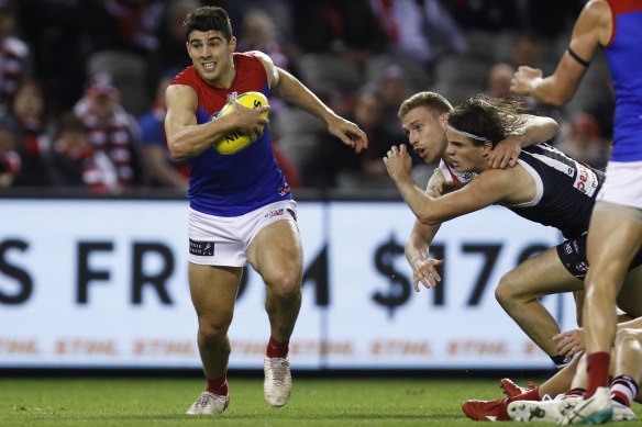 Christian Petracca of the Demons bursts away from a pack.