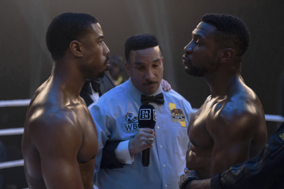 Adonis Creed (Michael B. Jordan, left) faces off with childhood friend and rival Dame Anderson (Jonathan Majors), in Creed III.