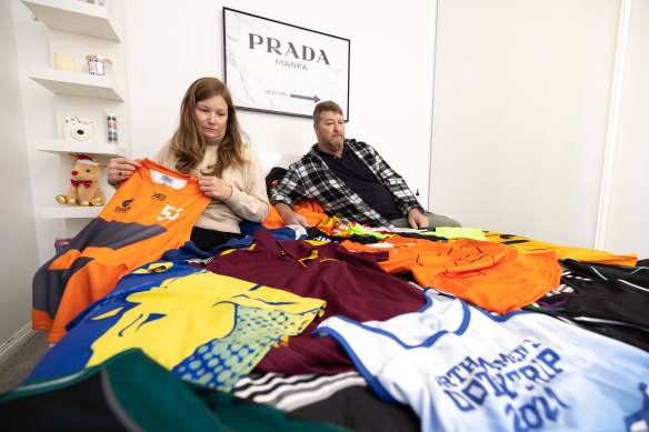 Anne and Deon Ryan in their late daughter Brooke’s room, with her sporting jerseys.