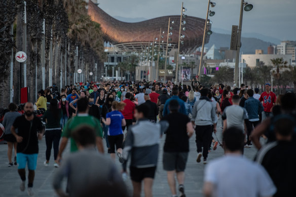 People filling the street in Barcelona on Saturday, able to exercise for the first time in months.
