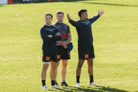 Cameron Murray, Liam Martin and Latrell Mitchell watch NSW training on Wednesday as they race the clock to be fit for game two.