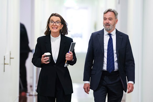 Senators Anne Ruston and Andrew McLachlan arrive for a Liberal party room meeting at Parliament House in Canberra.
