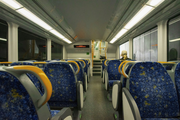 A lone passenger travels on a train in the CBD in April. 