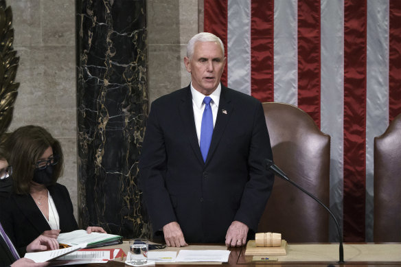 Vice-President Mike Pence reads the final certification of Electoral College votes on the night of the riots. 