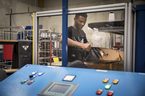 Abdoulie Barry, a 37-year-old from Gambia whose asylum claim was rejected, working at Vaude in Tettnang, Germany. Barry has appealed his rejection. 