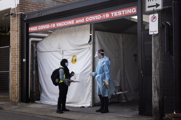 People wait for COVID-19 tests at a walk-in clinic in Lakemba on 28 August, 2021.