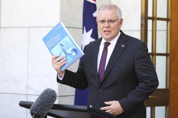 Prime Minister Scott Morrison with the Jenkins review.