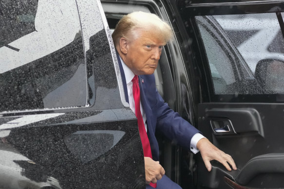 Former president Donald Trump arrives to board his plane at Ronald Reagan Washington National Airport.