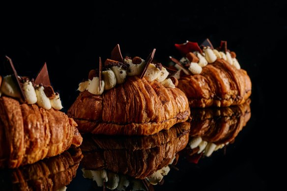 The croissant is topped with mascarpone chantilly cream, tempered chocolate shards, salted cookie crumb and Belgian truffles.