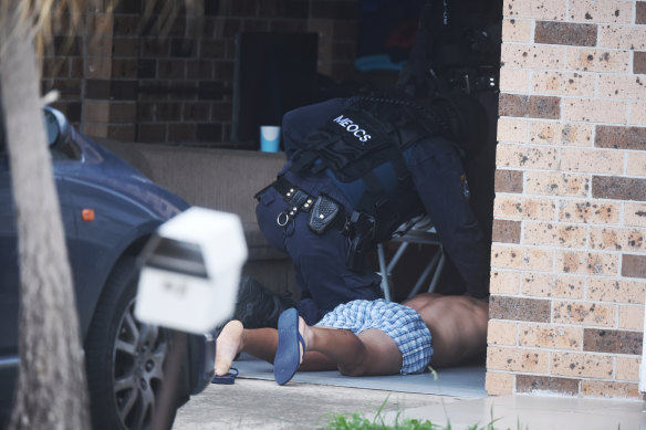 Middle Eastern organised crime squad of the NSW Police Force raid a house in Western Sydney.