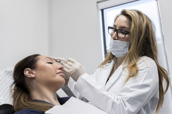 Cosmetic injector and nurse Matty Samaei administering botox to a patient. 