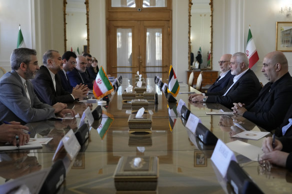 Hamas chief Ismail Haniyeh, second right, meets with Iranian Foreign Minister Hossein Amirabdollahian, second left, in Tehran, Iran, last month. 