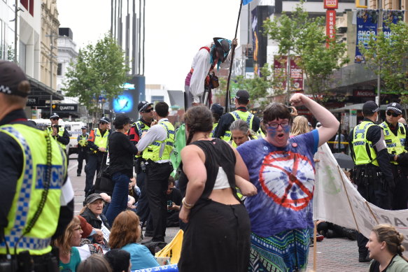 Extinction Rebellion protesters shut down the Perth CBD at the intersection of Hay Street and William Street. 