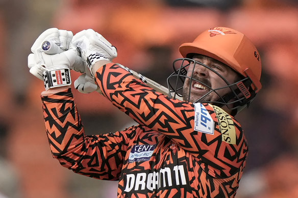 Travis Head hits out during his innings.