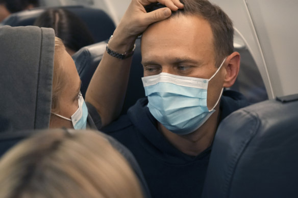 Alexey Navalny and his wife Yuliya on the plane bound for Moscow hours before his detention.