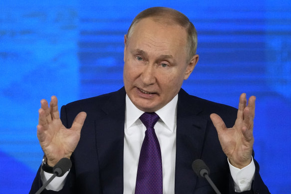 Russian President Vladimir Putin gestures while speaking during his annual news conference in Moscow, Russia.